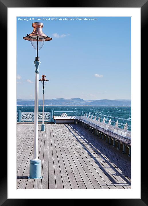 Lamp and seating on Mumbles Pier. Wales, UK. Framed Mounted Print by Liam Grant