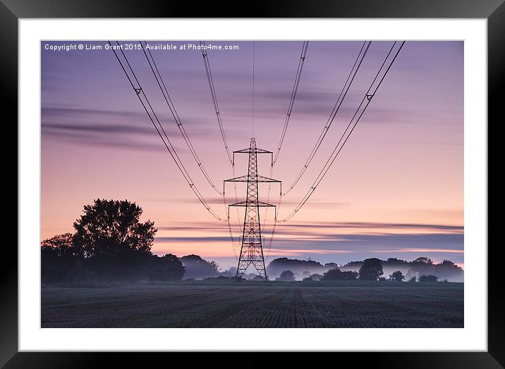 Sweeping clouds over an electricity pylon at twili Framed Mounted Print by Liam Grant
