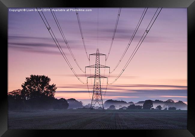 Sweeping clouds over an electricity pylon at twili Framed Print by Liam Grant