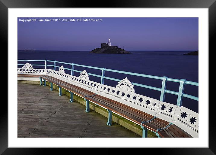 Lighthouse at dusk from Mumbles Pier. Wales, UK. Framed Mounted Print by Liam Grant