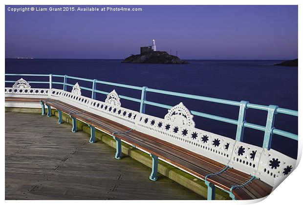 Lighthouse at dusk from Mumbles Pier. Wales, UK. Print by Liam Grant