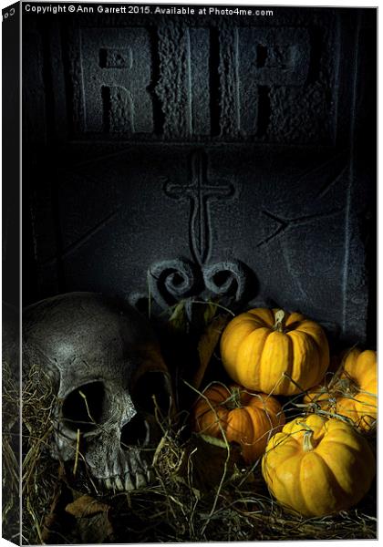 Skull Headstone and Pumpkins Canvas Print by Ann Garrett