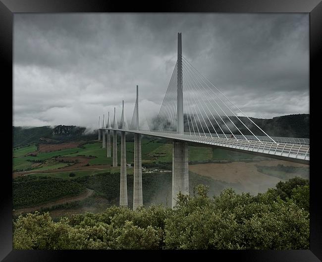 Millau viaduct under the clouds  Framed Print by Stephen Taylor