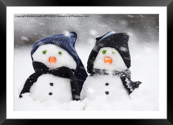 Two cute snowmen dressed for winter Framed Mounted Print by Simon Bratt LRPS