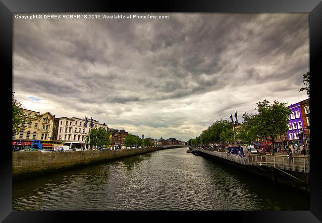 View to the Ha'penny Bridge Dublin on a stormy day Framed Print by DEREK ROBERTS