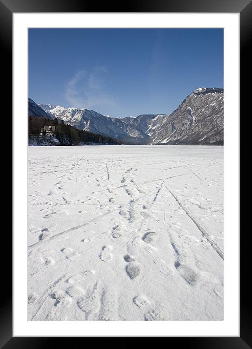 Footprints on a frozen lake Framed Mounted Print by Ian Middleton