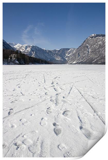 Footprints on a frozen lake Print by Ian Middleton