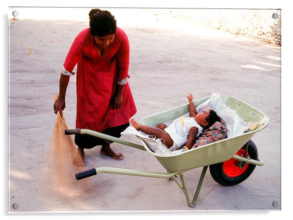  Mother keeps child in a wheel burrow while cleani Acrylic by Hassan Najmy