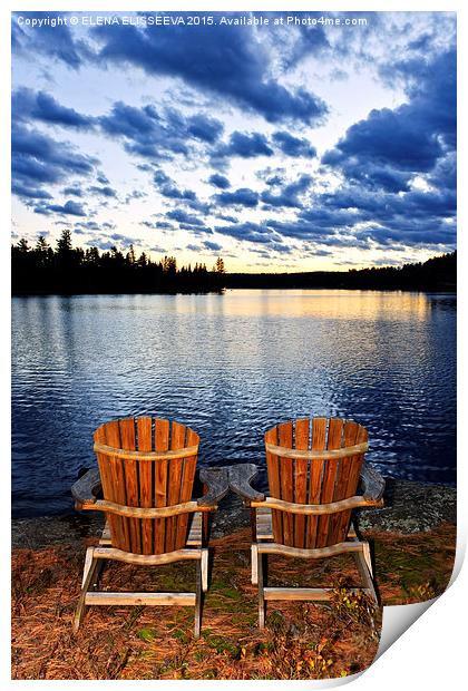 Wooden chairs at sunset on lake shore Print by ELENA ELISSEEVA