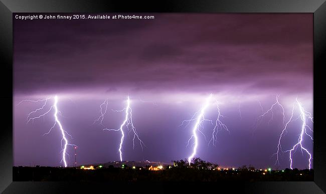 Lightning bolts over New Mexico, USA Framed Print by John Finney