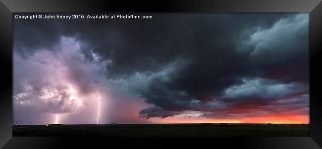 Kansas thunderstorm at sunset, panoramic Framed Print by John Finney