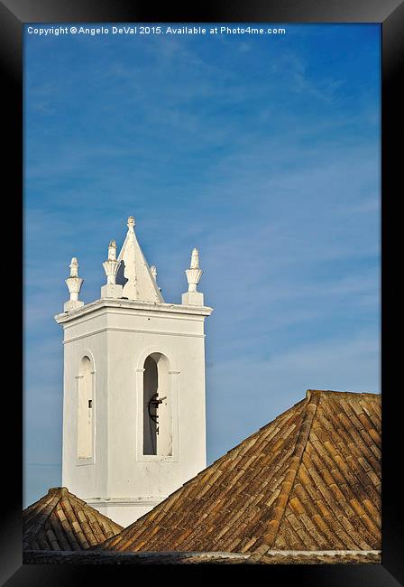 Church bell tower behind tiled roofs in Tavira  Framed Print by Angelo DeVal