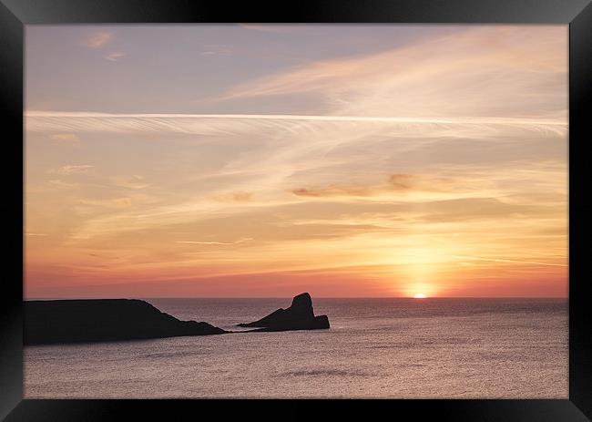 Worms Head at sunset. Wales, UK. Framed Print by Liam Grant