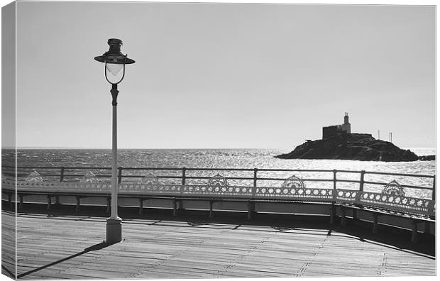 Lighthouse from Mumbles Pier. Wales, UK. Canvas Print by Liam Grant