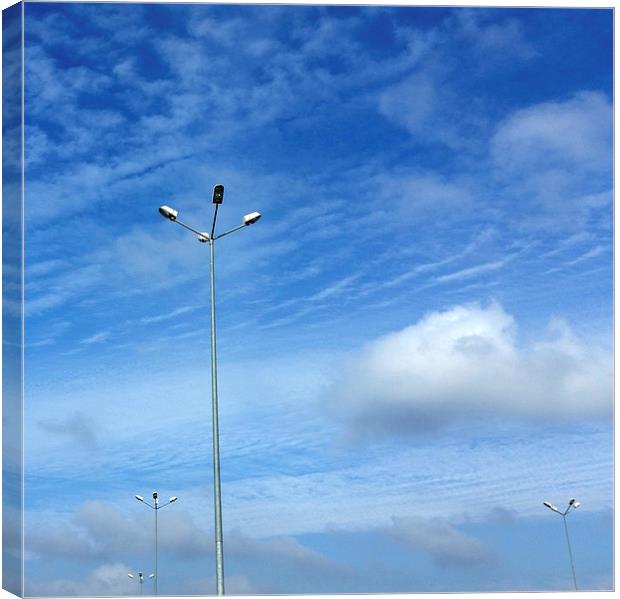 lamps under blue sky Canvas Print by Marinela Feier