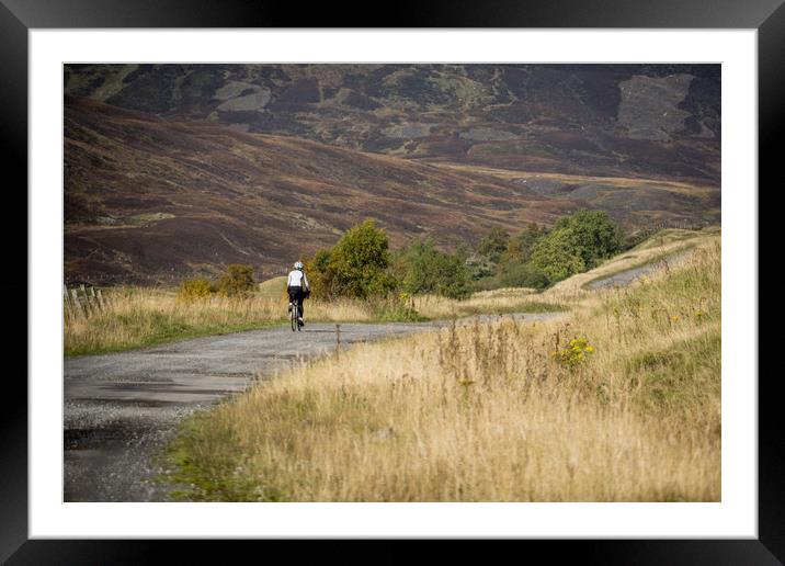  The lonely cyclist Framed Mounted Print by Brent Olson