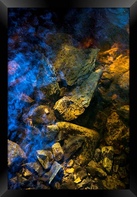 Rocks below the water of a moorland stream Framed Print by Andrew Kearton