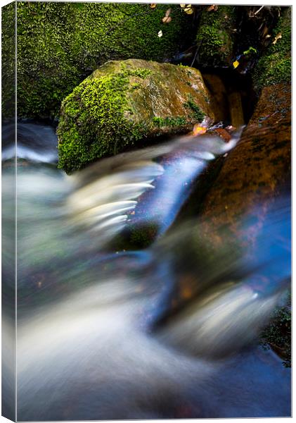  Smooth flow in a moorland stream Canvas Print by Andrew Kearton