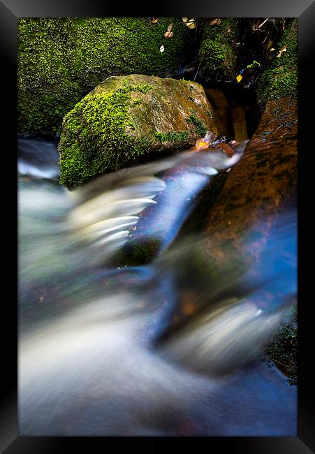  Smooth flow in a moorland stream Framed Print by Andrew Kearton