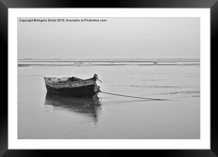 Fishing boat resting on the low tide  Framed Mounted Print by Angelo DeVal