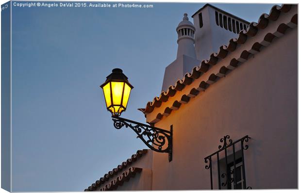 Warm Glow of Algarve Street Lamp Canvas Print by Angelo DeVal