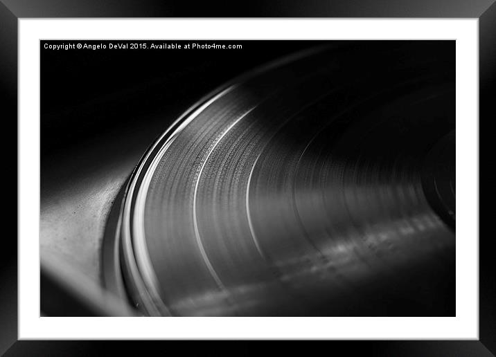 Vinyl record on a turntable. Memory and nostalgia  Framed Mounted Print by Angelo DeVal
