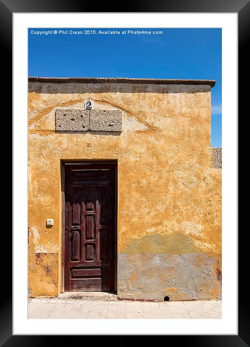  Textured ochre wall, dark red door Tenerife Framed Mounted Print by Phil Crean