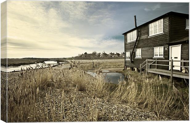 Black wooden house overlooking a stream Canvas Print by Stephen Mole