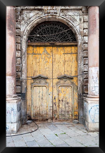 What is behind the yellow door ? Framed Print by Dave Carroll
