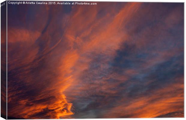 Brooding orange sunset clouds Canvas Print by Arletta Cwalina