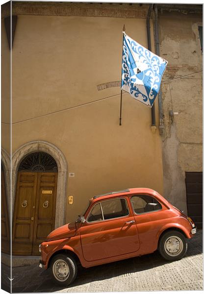 Old Fiat parked in steep street on a hill in Italy Canvas Print by Ian Middleton