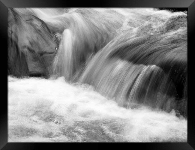 Fluidity in Motion Framed Print by Tommy Dickson