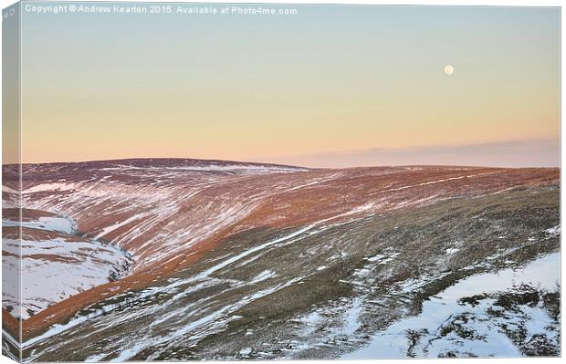  Moon rising above the snowy moors Canvas Print by Andrew Kearton