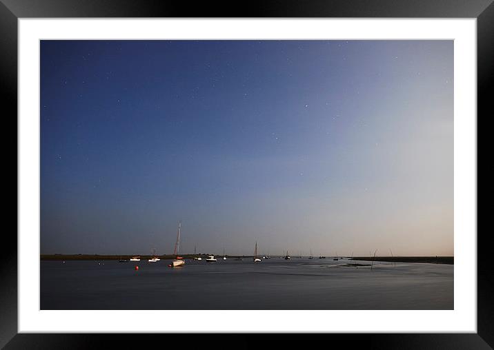 Moonlight on boats under a star filled sky. Branca Framed Mounted Print by Liam Grant