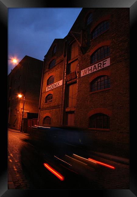 Wapping Taxi Blur Framed Print by mark blower