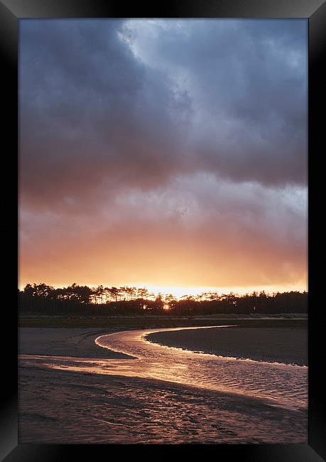 Storm clouds at sunset. Holkham, Norfolk, UK. Framed Print by Liam Grant