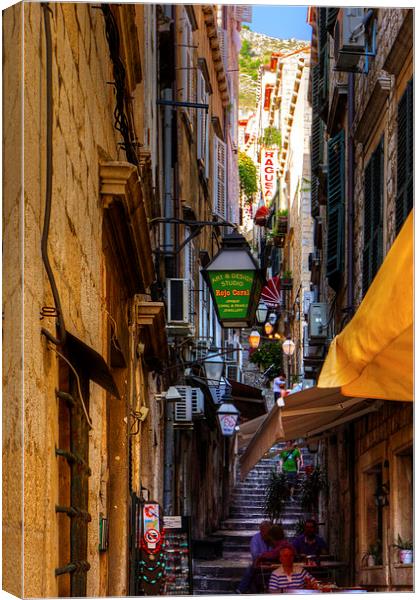 Cafe in a Dubrovnik Alley Canvas Print by Tom Gomez