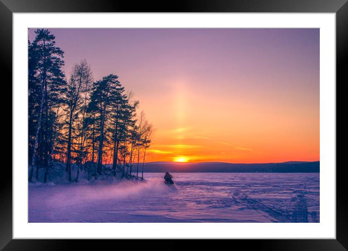 The snow mobile race toward the Sun pillar Framed Mounted Print by Svetlana Korneliuk