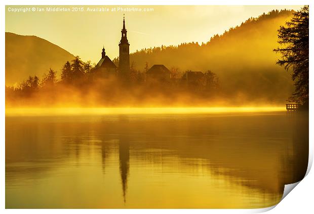 Misty Lake Bled at sunrise Print by Ian Middleton
