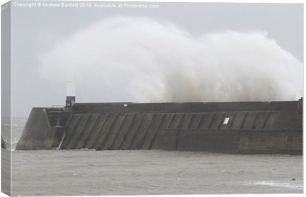  Porthcawl lighthouse in Storm Barney Canvas Print by Andrew Bartlett