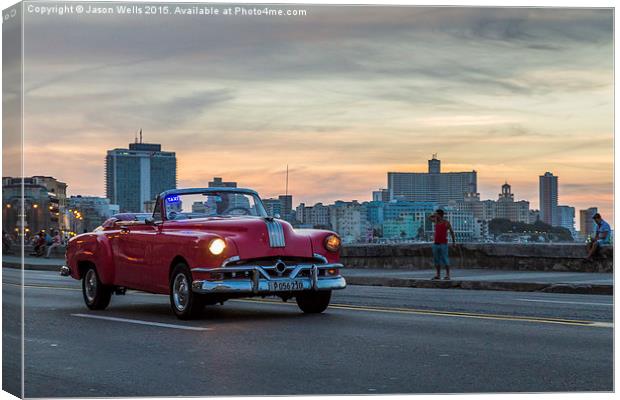 Pink car on the Malecon Canvas Print by Jason Wells
