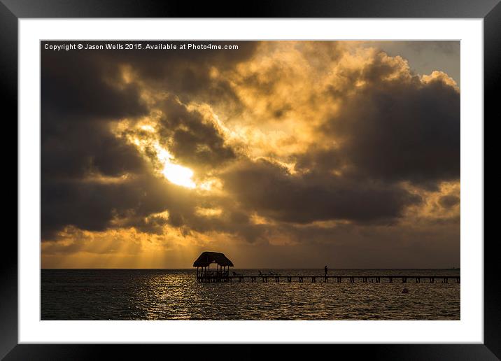 Rays of sun above a jetty Framed Mounted Print by Jason Wells