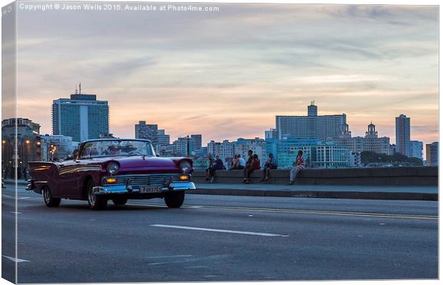 Tourists in a vintage car on the Malecon Canvas Print by Jason Wells