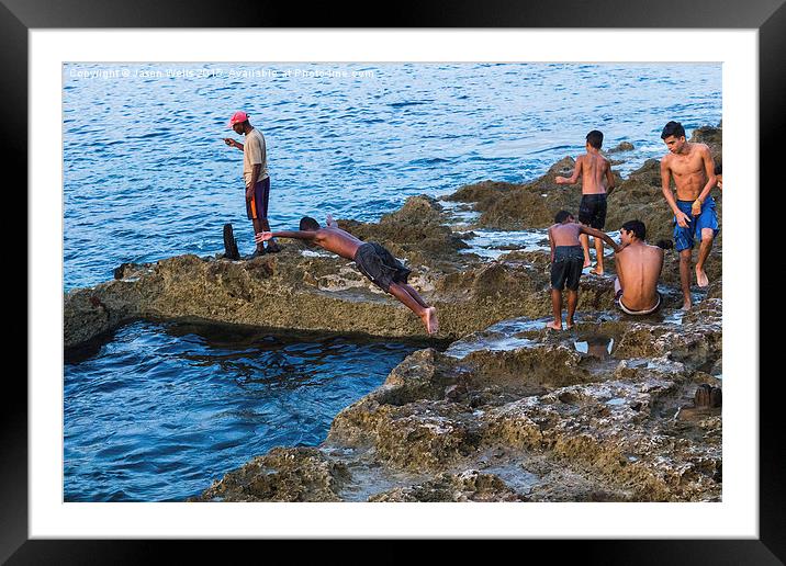 Boys cooling off in the sea Framed Mounted Print by Jason Wells