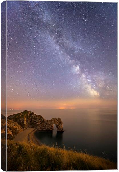  The Milky way over Durdle Door in Dorset Canvas Print by Shaun Jacobs
