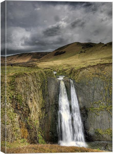 Storm Brewing Over Speke Mill Mouth Waterfall Canvas Print by Mike Gorton