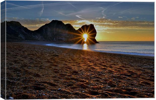 Sunrise through Durdle Door on a winter morning  Canvas Print by Shaun Jacobs