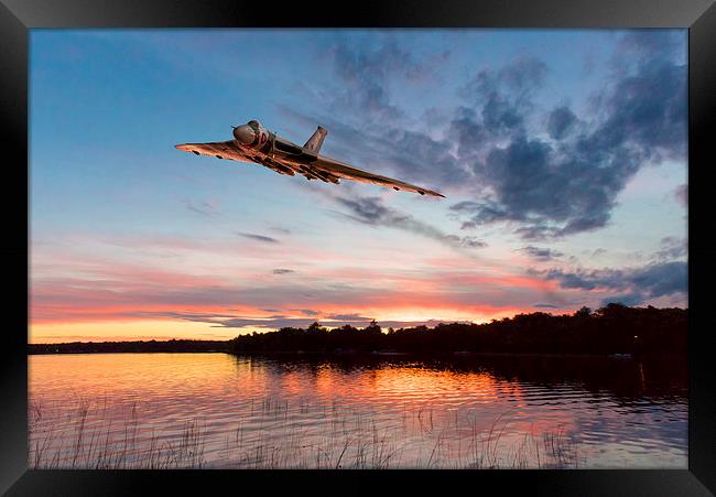 Vulcan low over a sunset lake Framed Print by Gary Eason