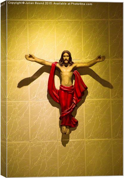 Jesus on the cross, Goa, India Canvas Print by Julian Bound
