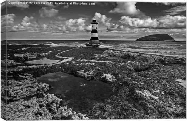  Penmon Lighthouse and rock pool Canvas Print by Pete Lawless